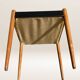 Set of 6 modernist chairs with black faux leather seats.