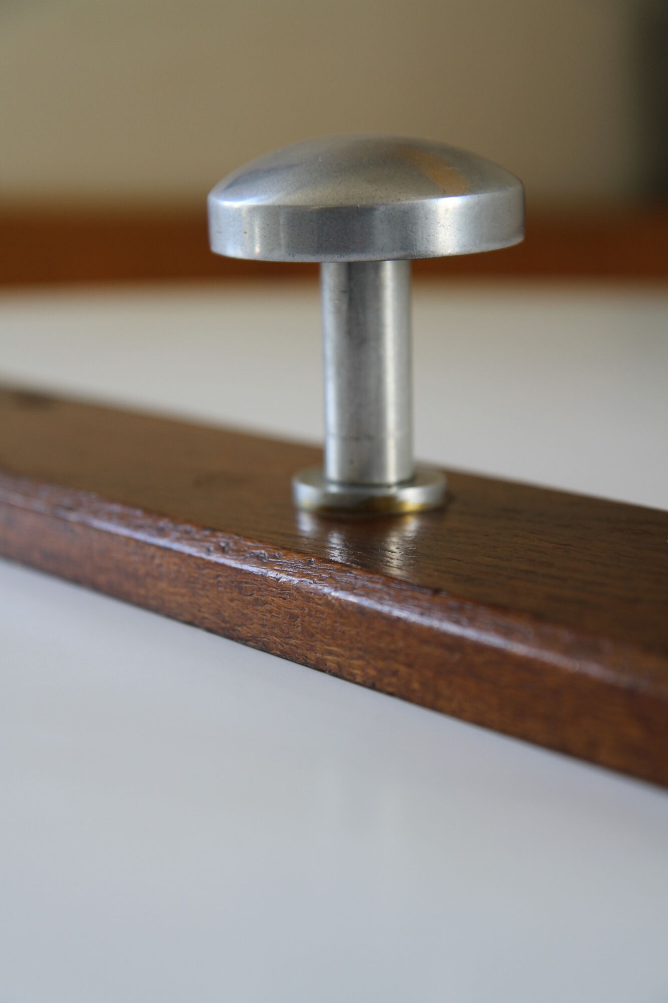 Wooden and stainless steel coat holders from the 1920s