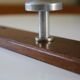 Wooden and stainless steel coat holders from the 1920s