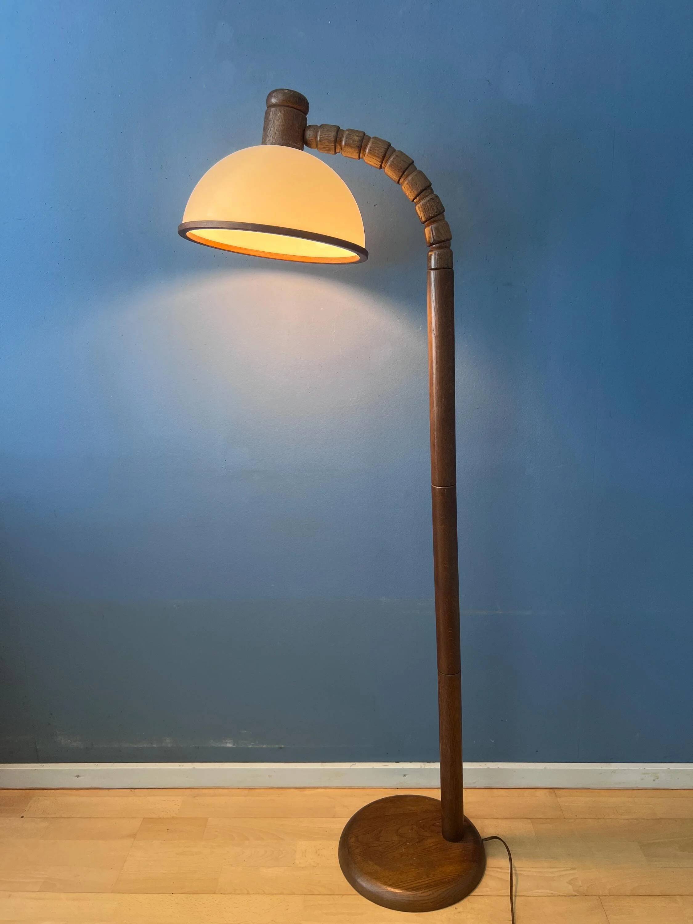Mid-century floor lamp in brown wood by Steinhauer with an acrylic glass shade.