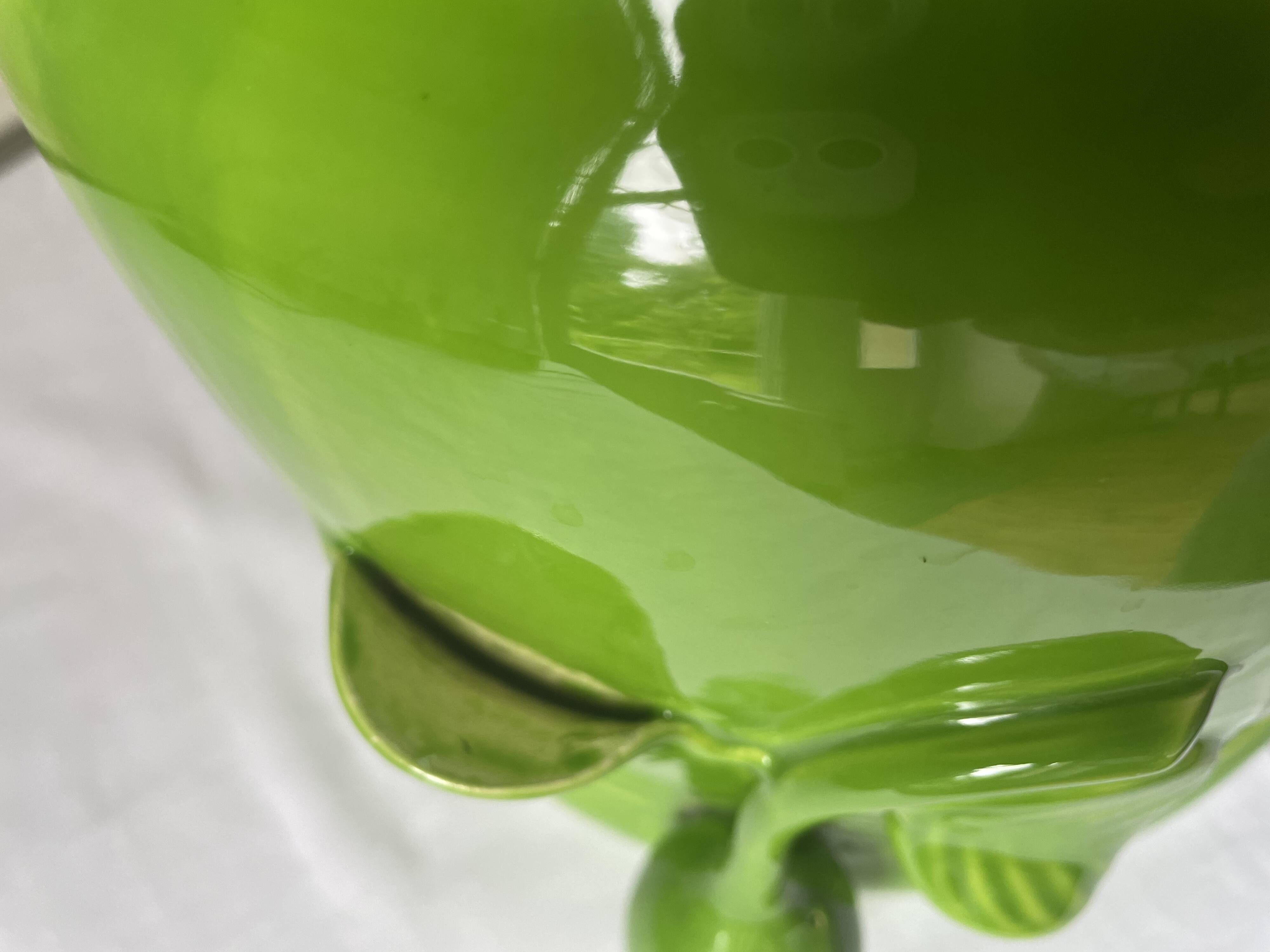 Glazed green pot cover in the style of Moreau Bourg earthenware