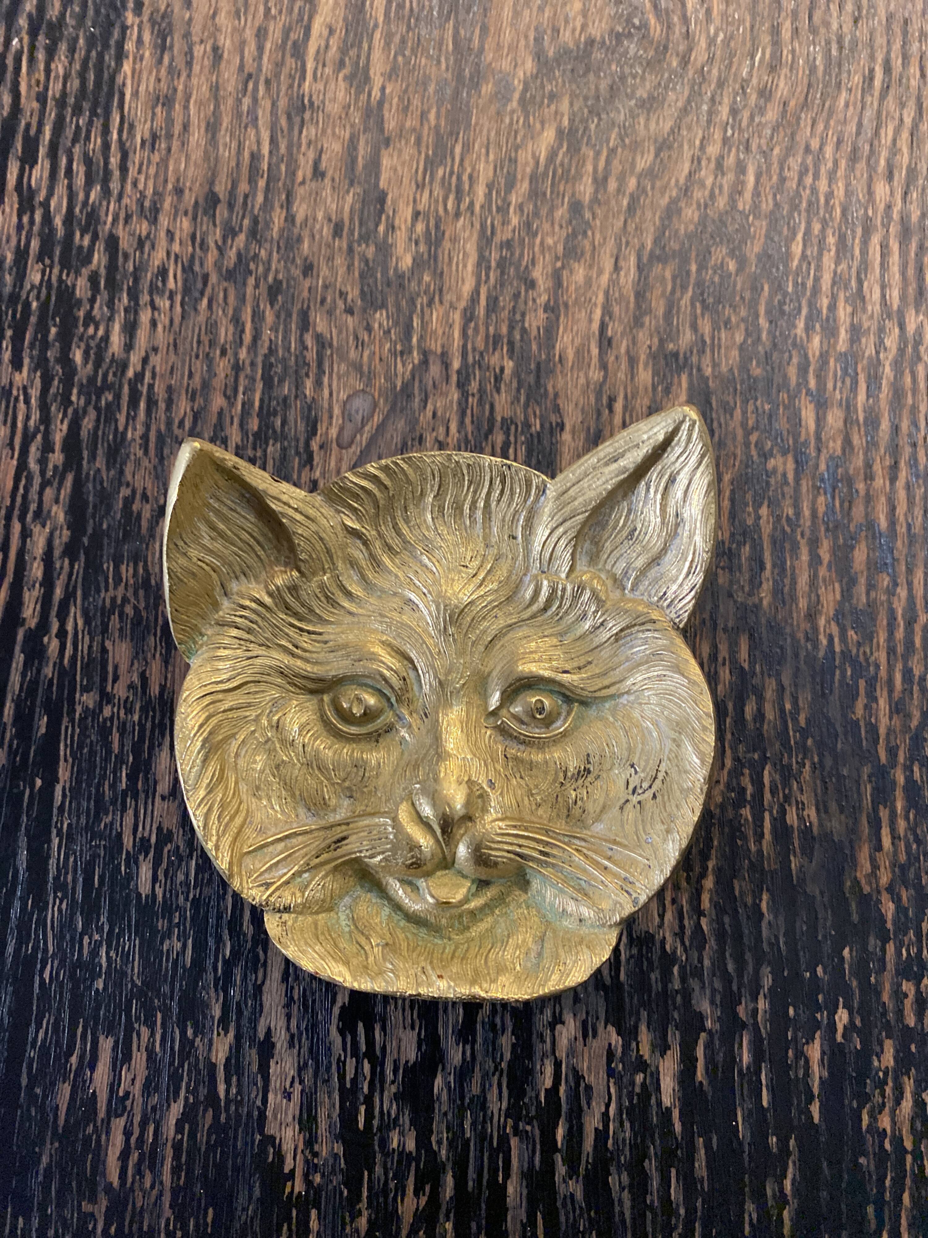 Brass cat's head