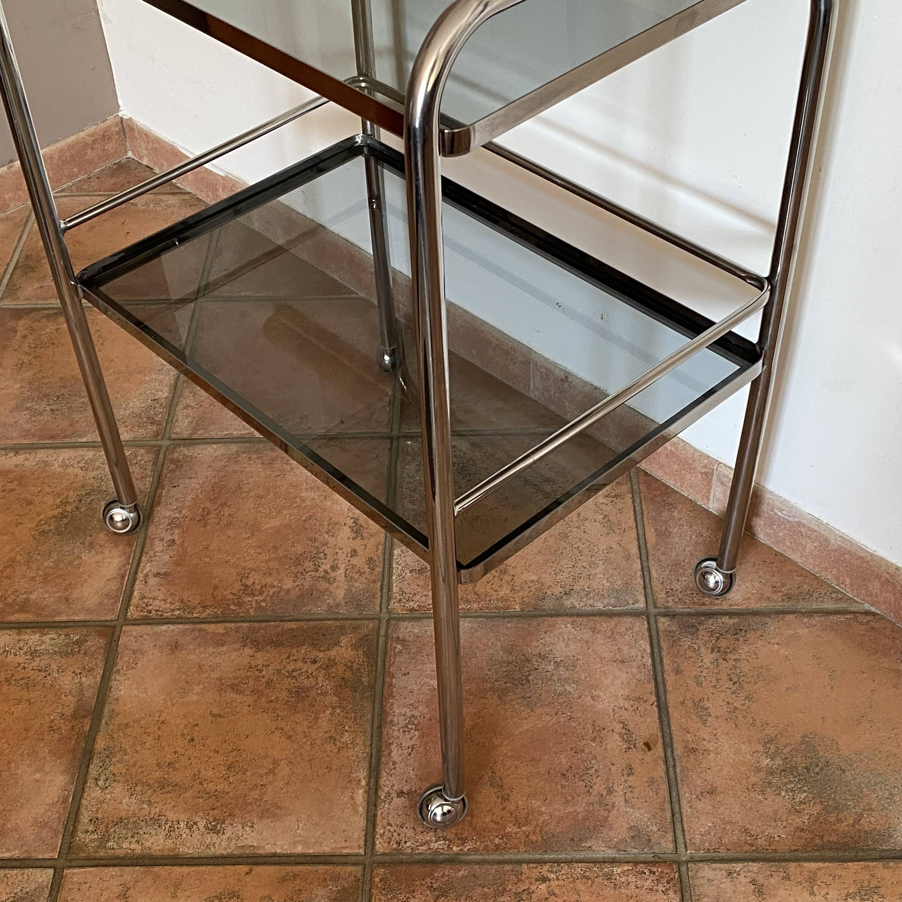 Trolley on wheels in chromed metal and smoked glass, 1970