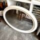 Oval mirror in pearl-coloured stucco 85 x 114 cm