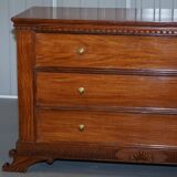 Set of hardwood dressers with finely carved bases.
