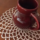 Old dark red ceramic pitcher jug