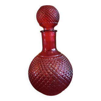 Red glass vitae bottle