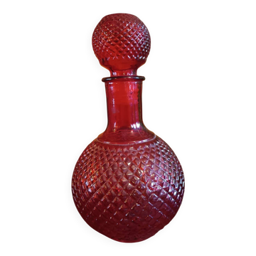 Vintage red glass bottle