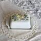 Large vintage faience butter dish with a fruit motif.