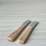 Pink bakelite butter knives.