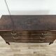 Chest of drawers with five drawers in wood and brass