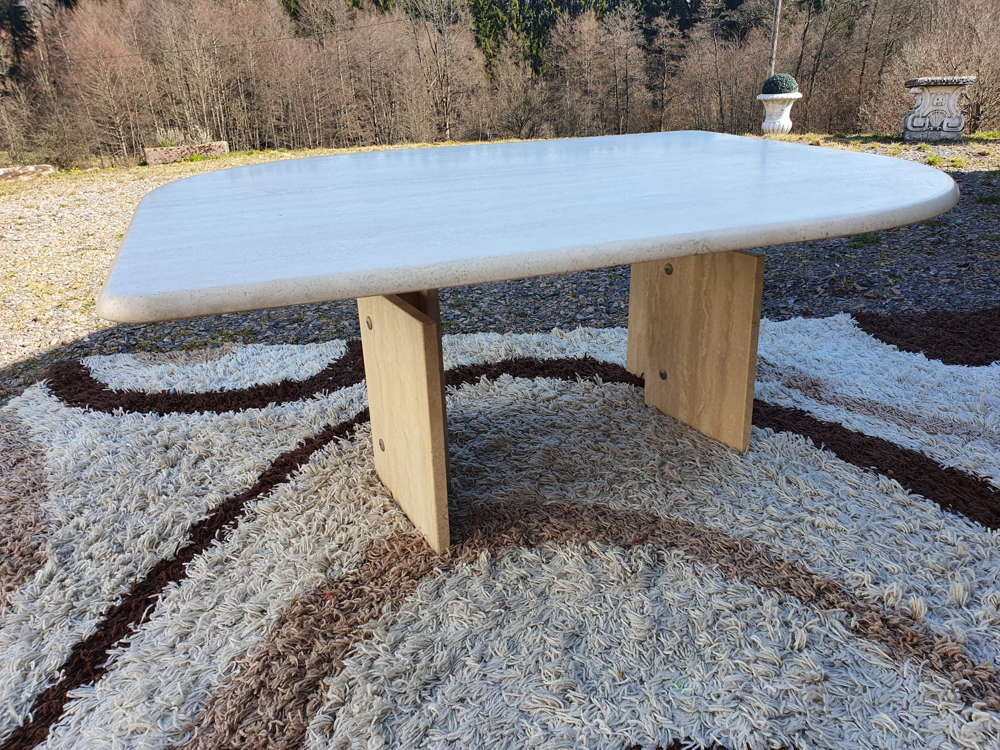 Adjustable travertine coffee table eye shape