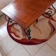 Coffee table in cherry wood with a wrought iron base.