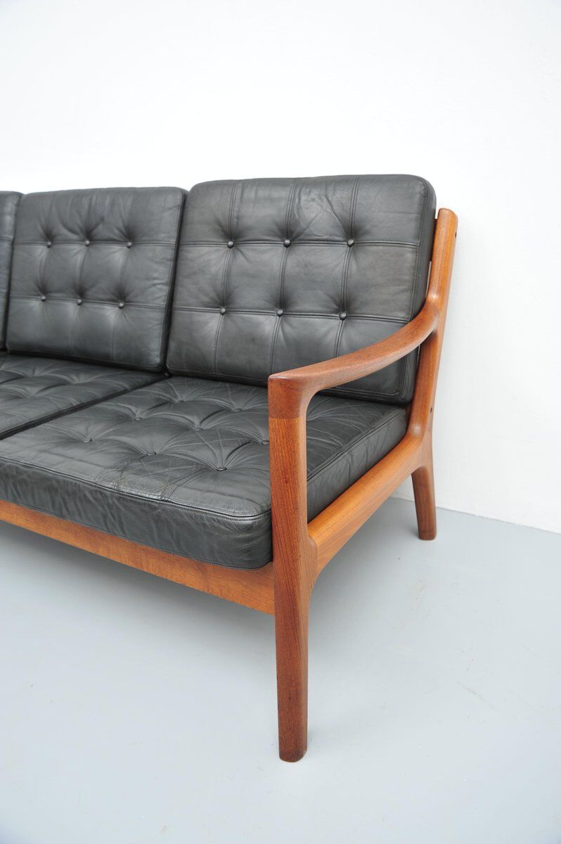 Senator sofa with black leather cushions by Ole Wascher for France and Son