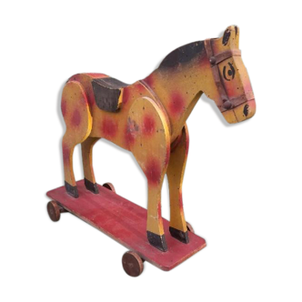 Old toy horse on wheels
