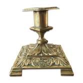 Old brass candle holder with square base