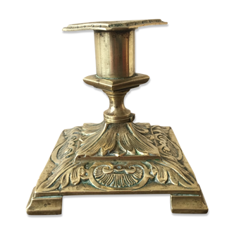 Old brass candle holder with square base