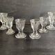 Set of antique liqueur glasses in thick glass, bistro style.