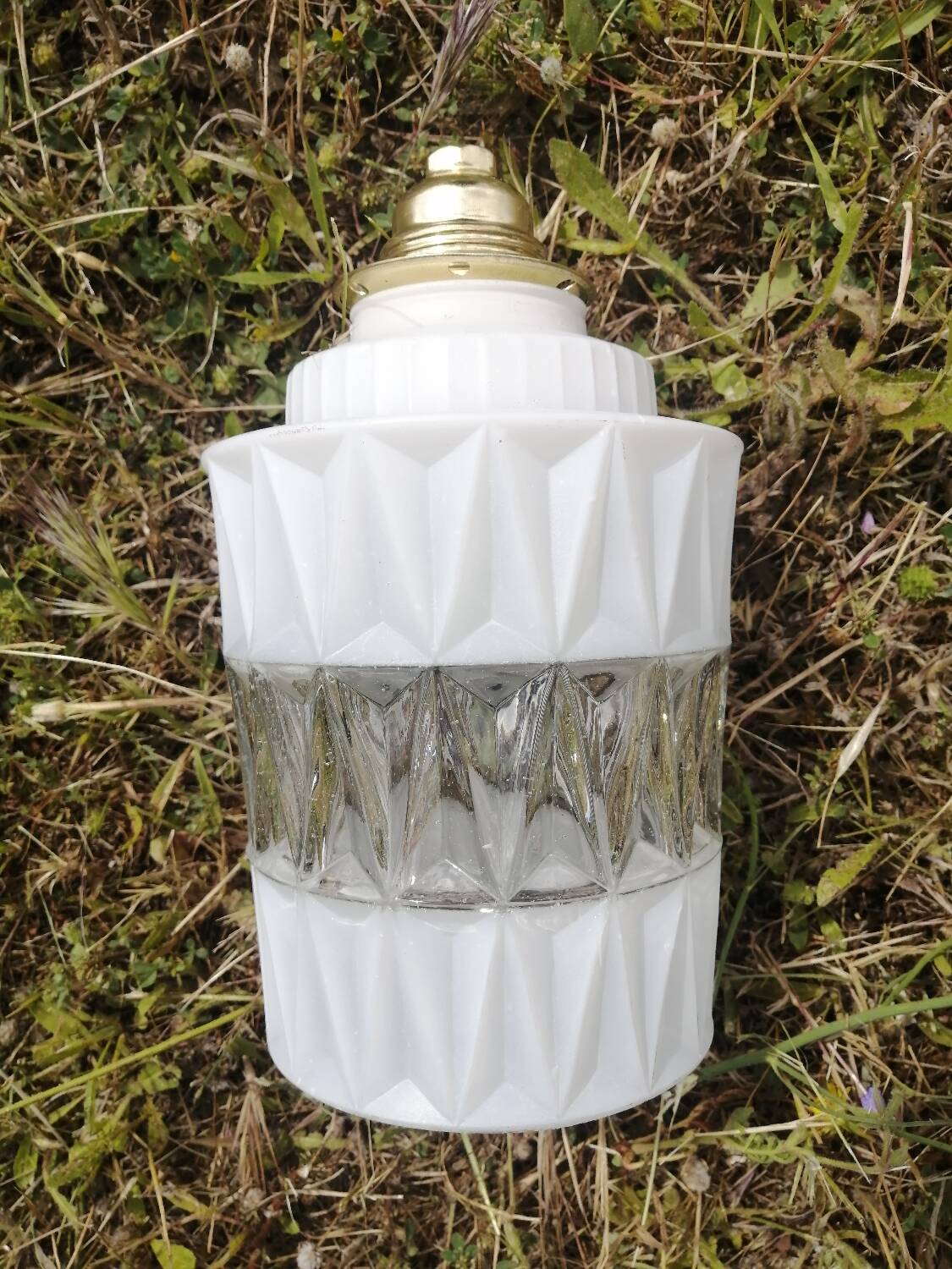 Vintage globe pendant light in molded glass.