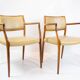 Pair of N.O. Moeller armchairs, model 65, in rosewood and light leather