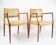 Pair of N.O. Moeller armchairs, model 65, in rosewood and light leather