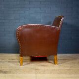 Antique club armchair of leather cloth