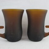 pair of small brown glass cups