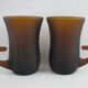 pair of small brown glass cups