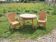Old living room in light rattan: table & 2 armchairs