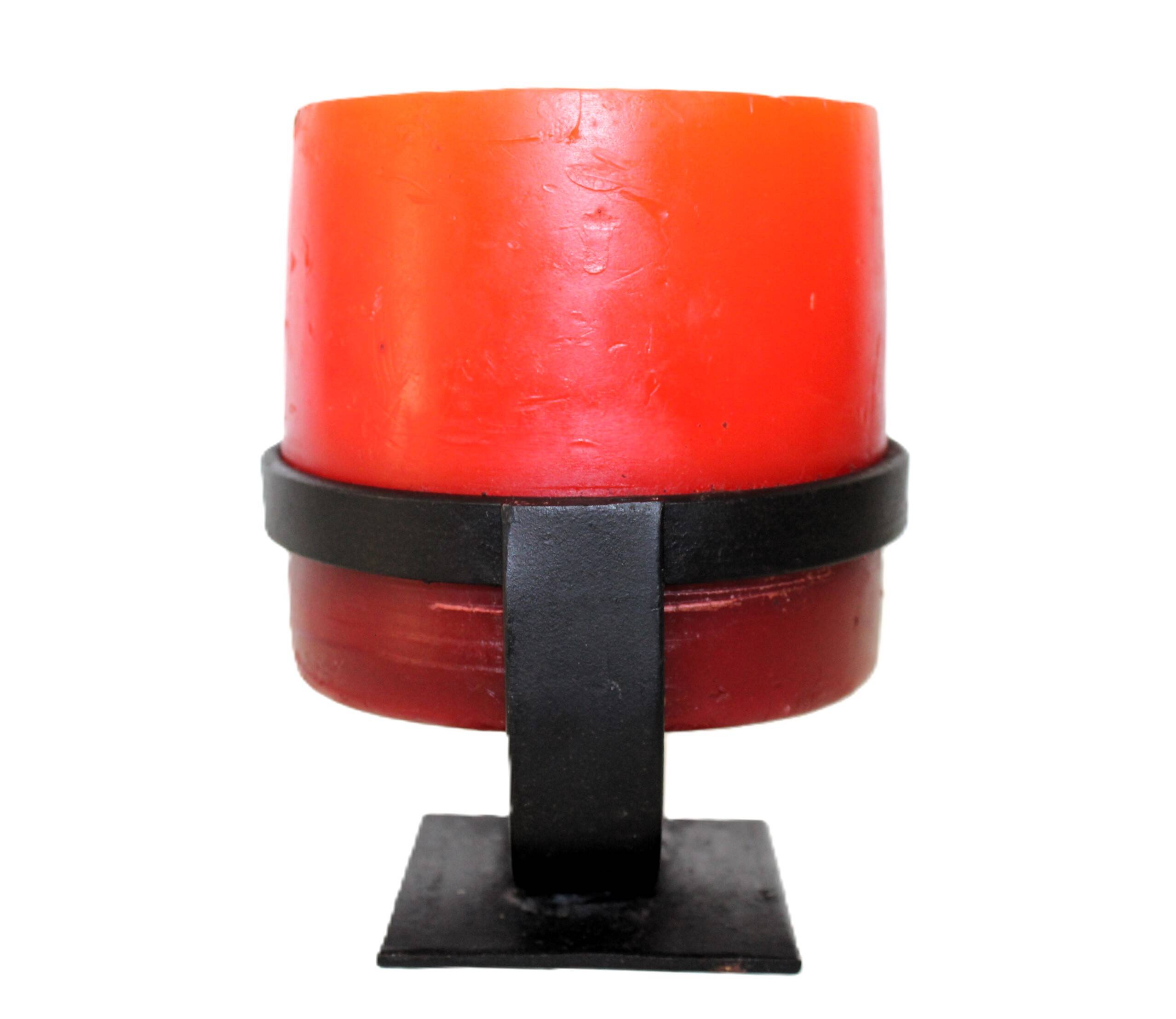 1970 wrought iron candlestick with its period coloured candle.