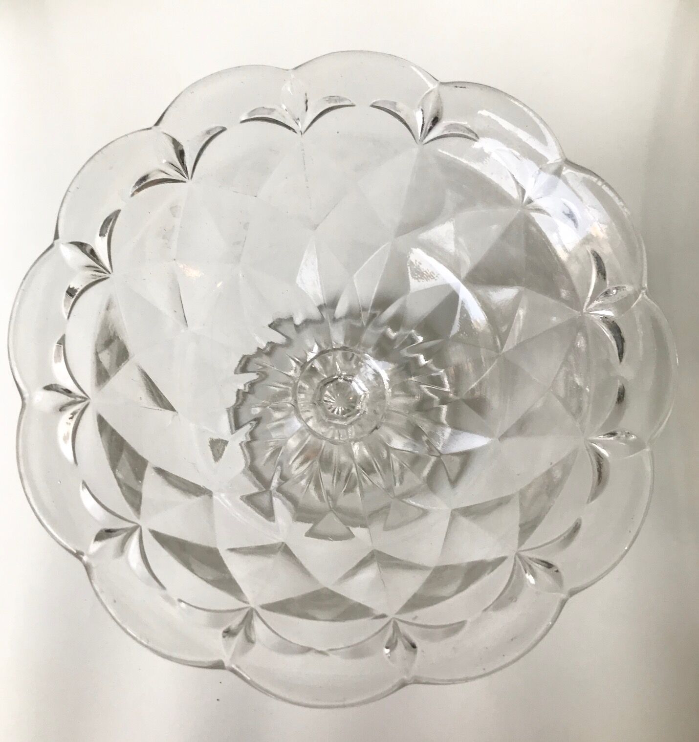 Old cut on foot faceted glass