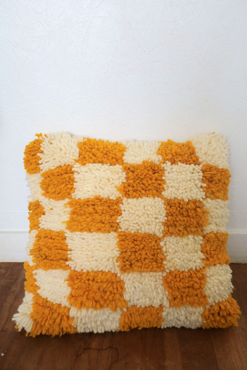 Berber cushion with orange and white checkerboard