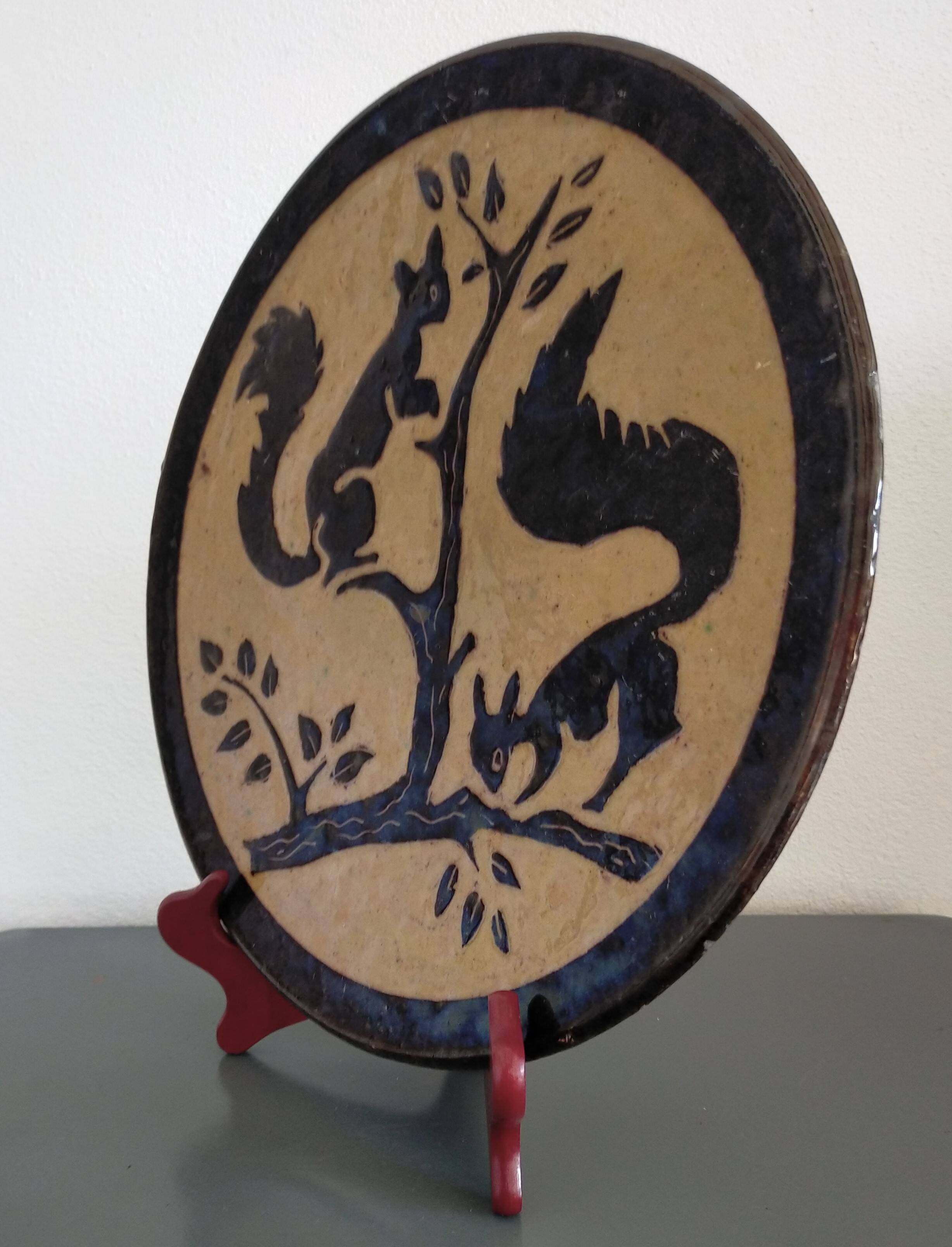 Vintage plate from Dauphiné in glazed terracotta with squirrels.