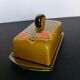 Butter maker in enamelled slurry