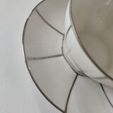 Two Art Deco porcelain cups and saucers with silver trim.