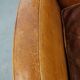 Characteristic sheepskin design armchair in beautiful warm cognac colours