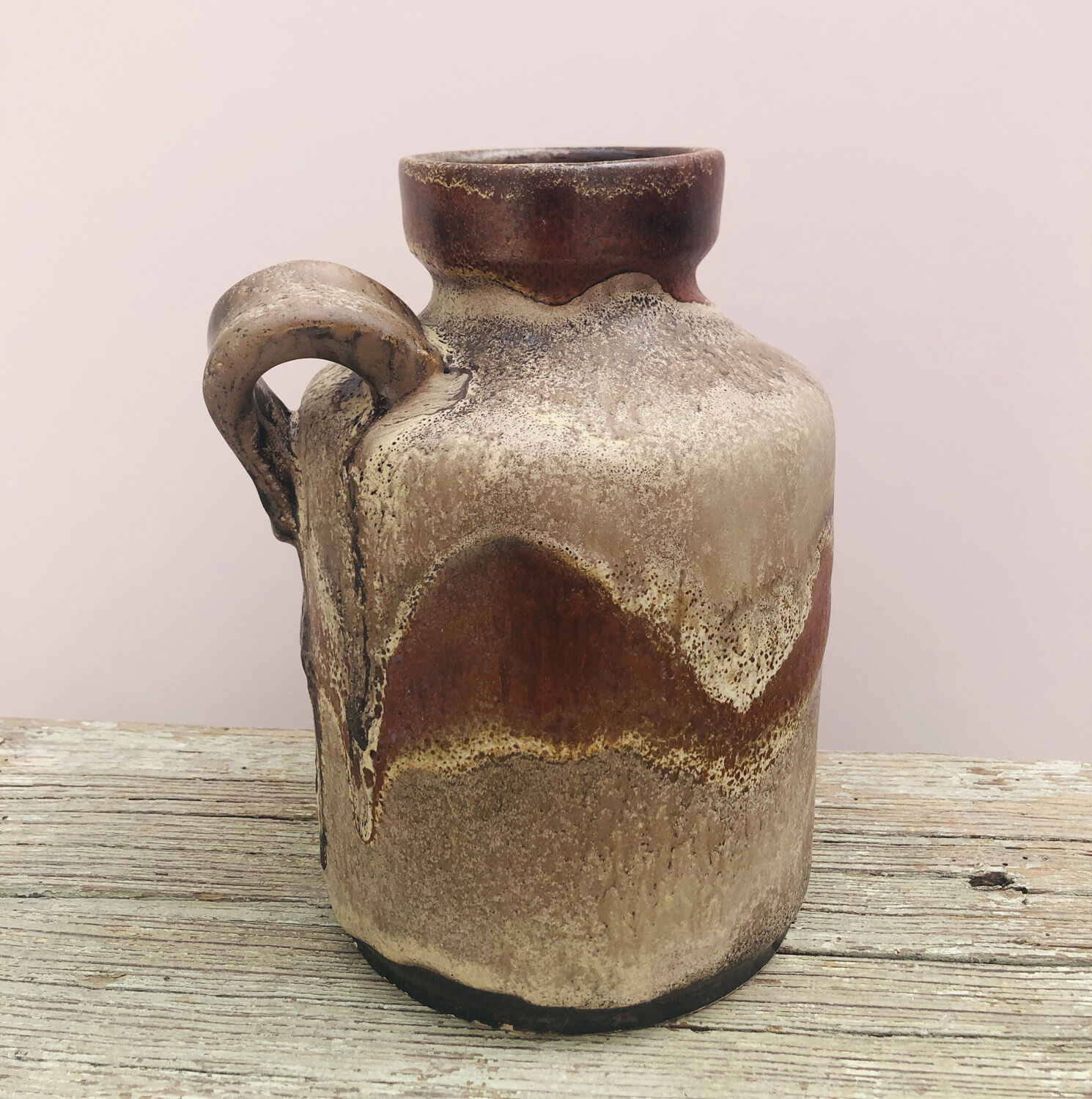 Ancient sided jug in flamed sandstone