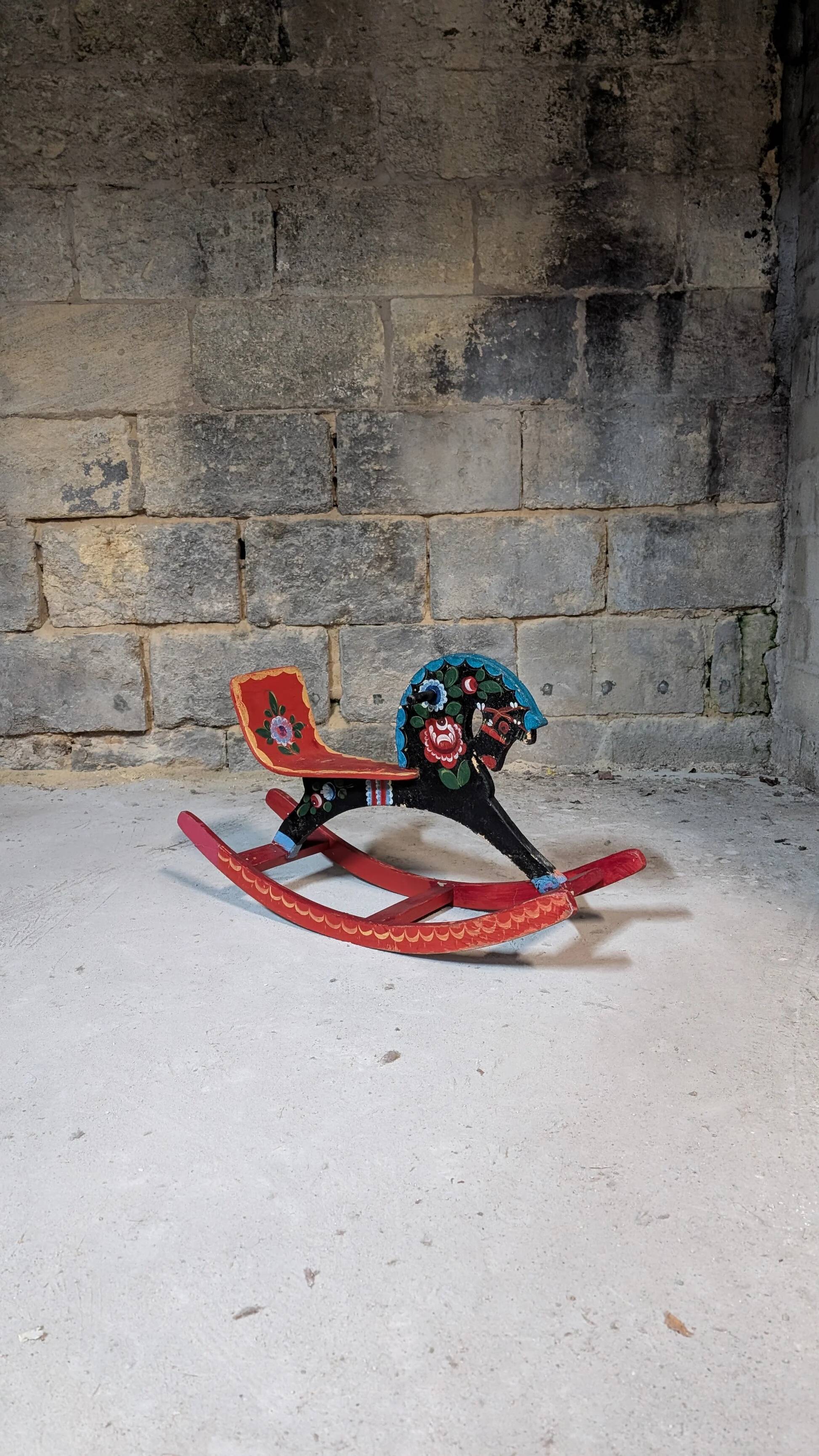 Painted wooden rocking horse