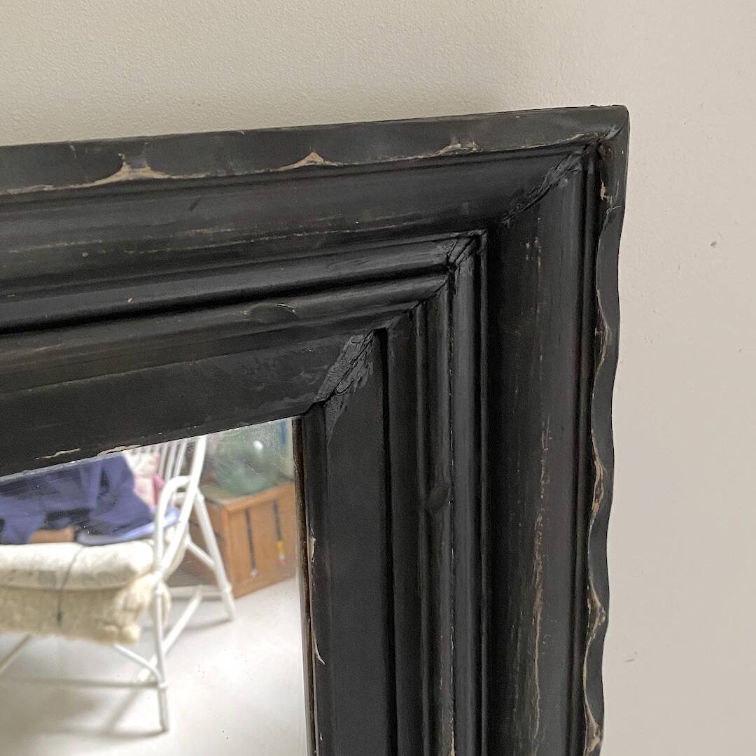 1950s mirror, matte black wood with a patina.