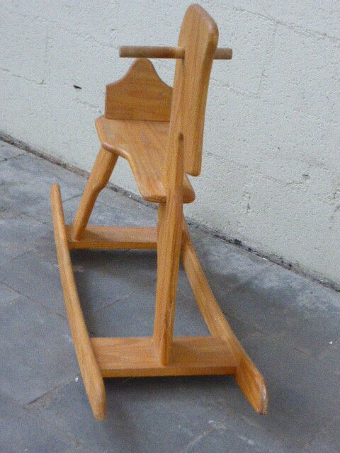 Horse rocking in pine