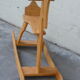 Horse rocking in pine