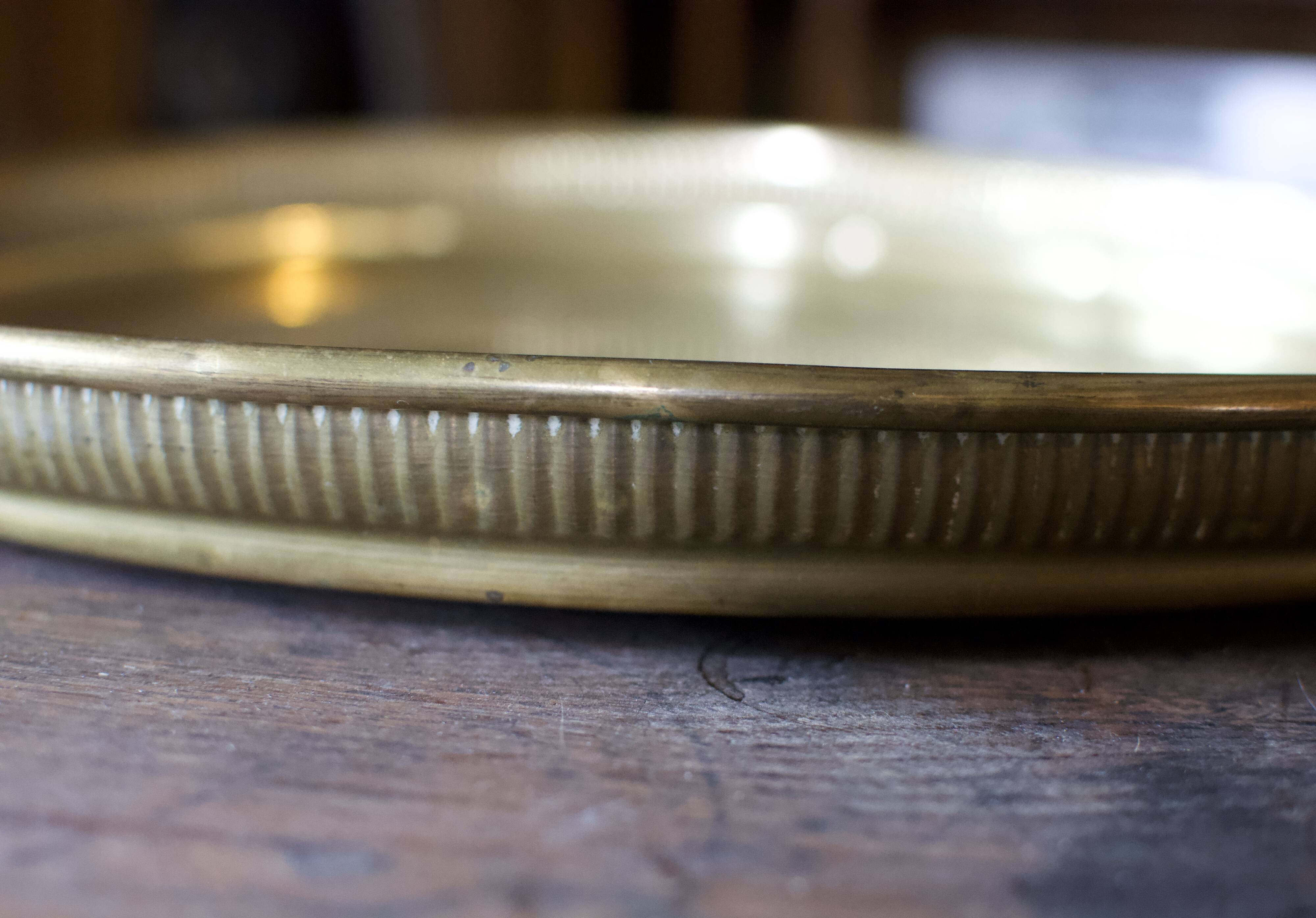 Golden service tray in vintage brass