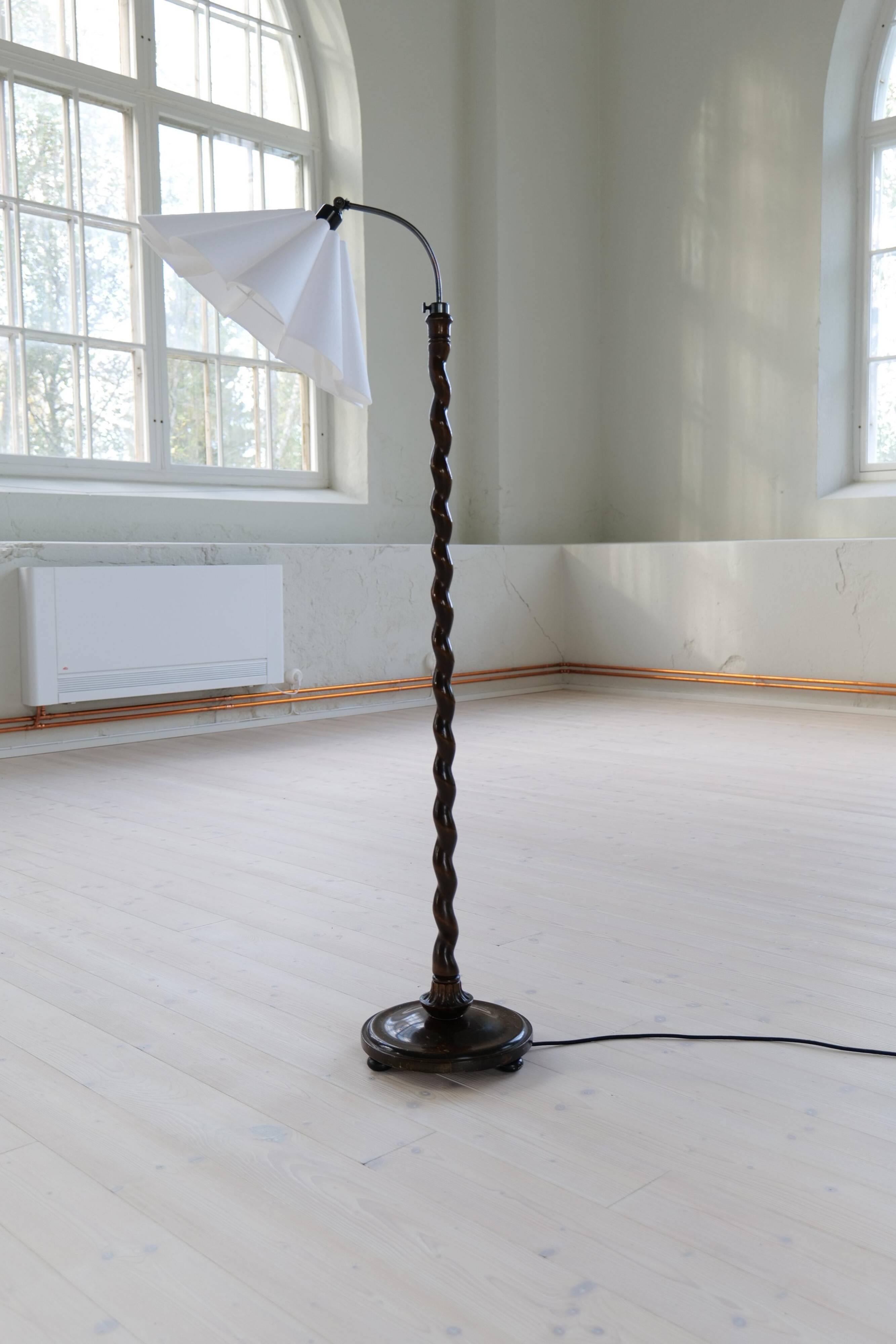 Organic whirlwind floor lamp in stained birch, Sweden, 1940s.