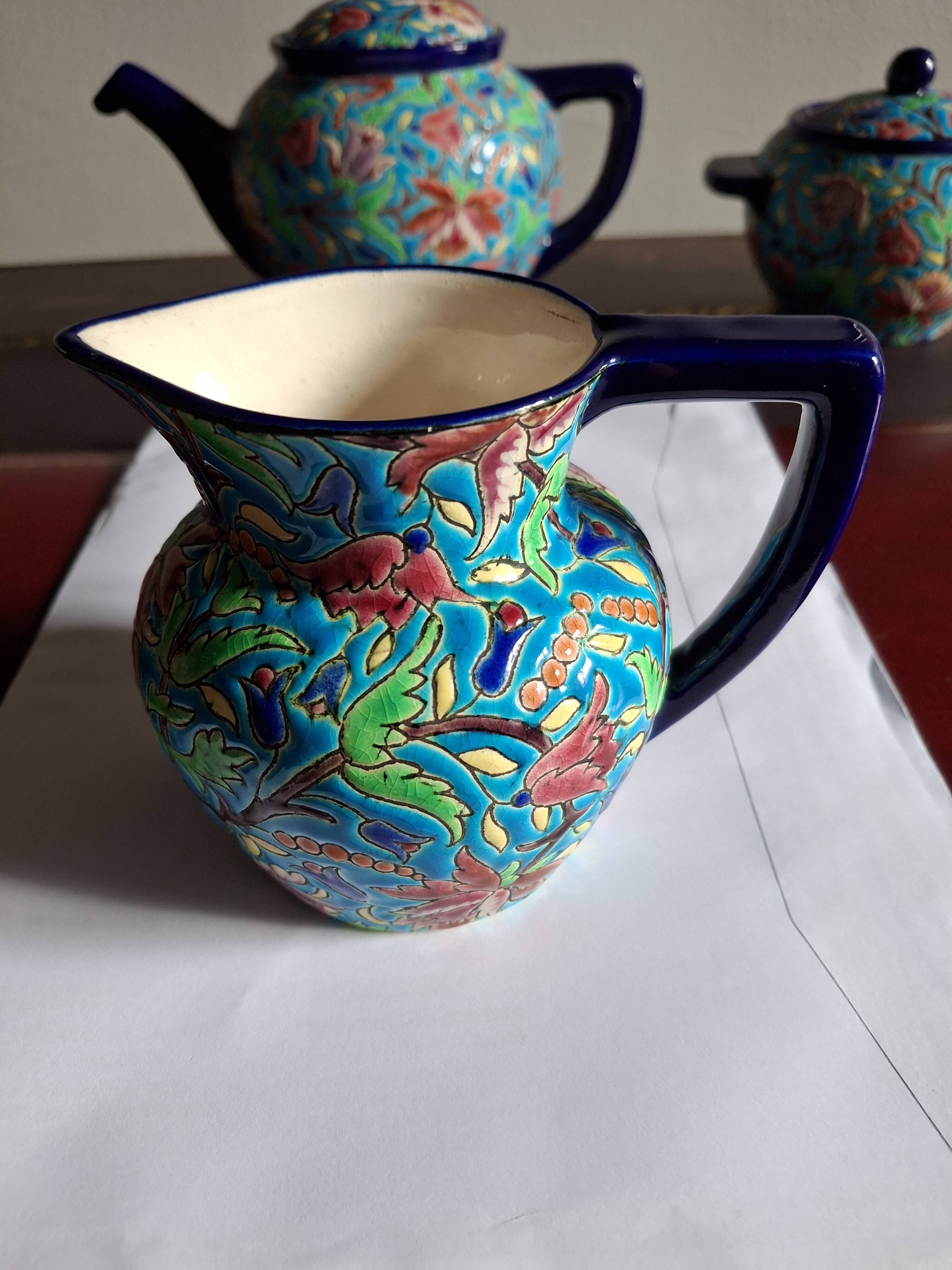 Cloisonné enamel tea service from Longwy in excellent condition.