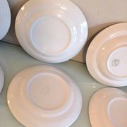 Set of six flat plates and one Moulin des Loups bowl, green tablecloth model/1950s-1960s