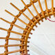 Vintage sun mirror in woven rattan – 60s/70s