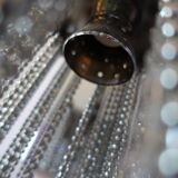 Swarovski wall lamp in silver-plated metal with crystal pendants.