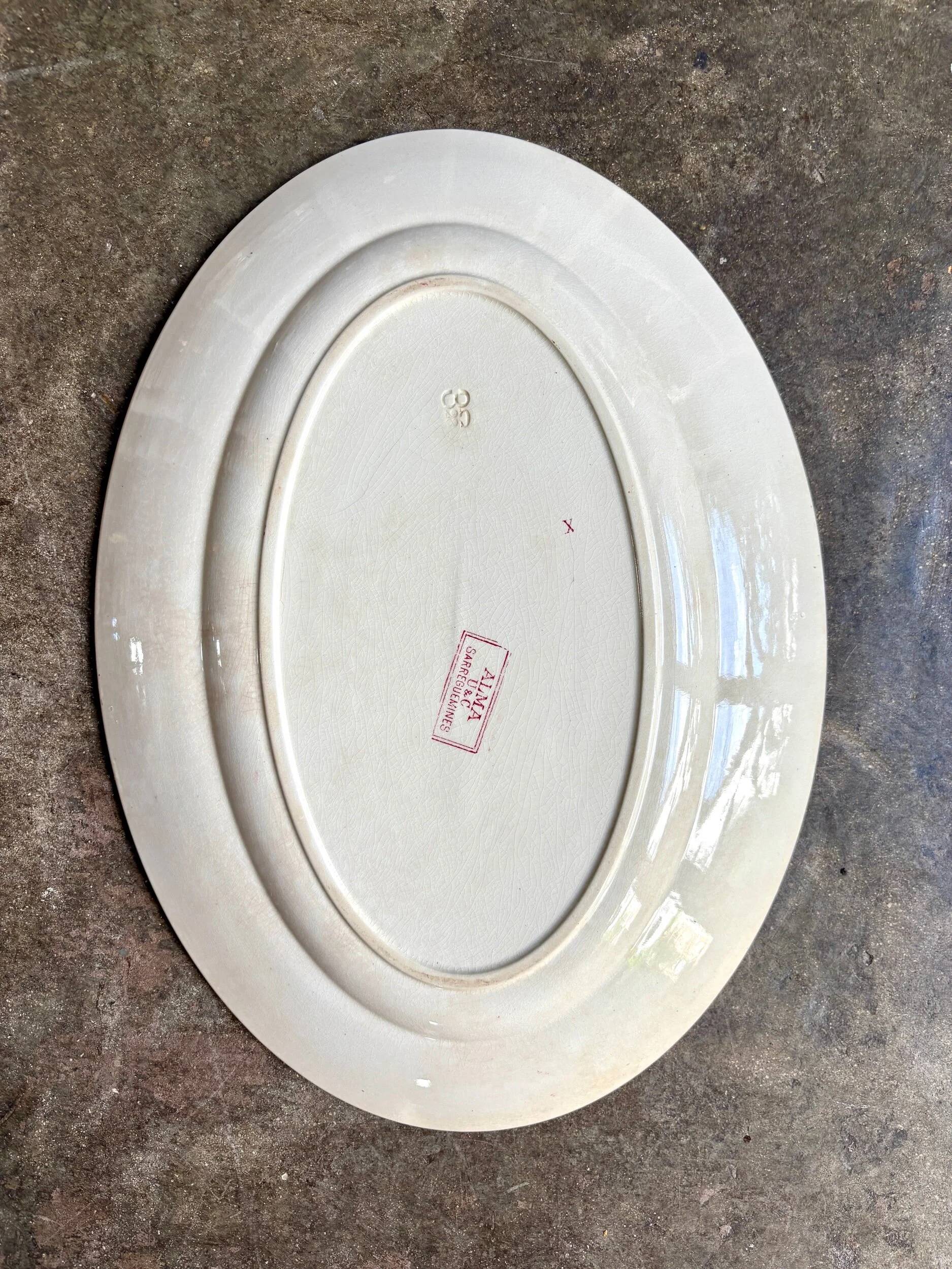 Sarreguemines oval dish in pink ironstone, "Alma" service