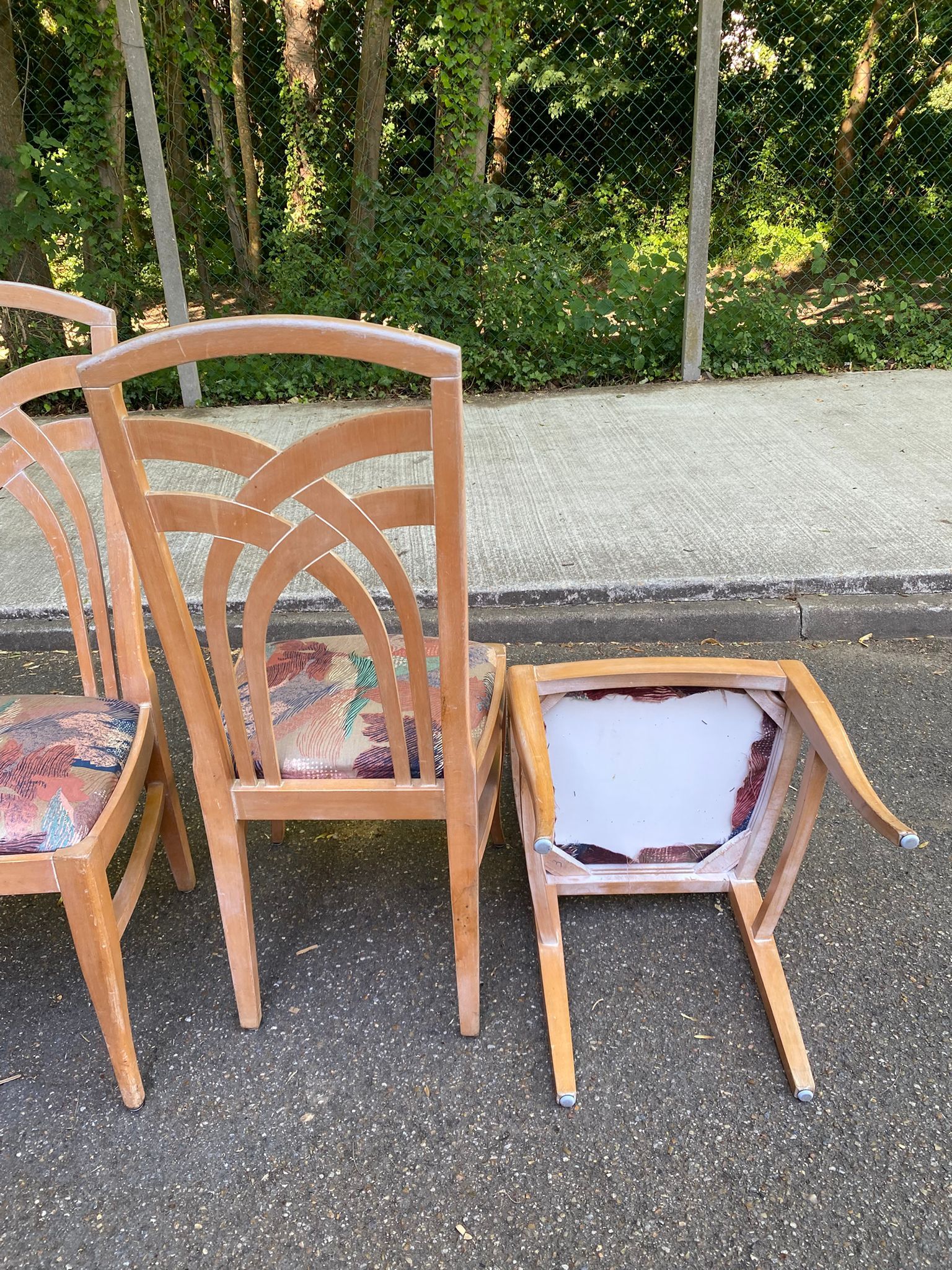 2 dining or kitchen chairs with high backs and fabric.