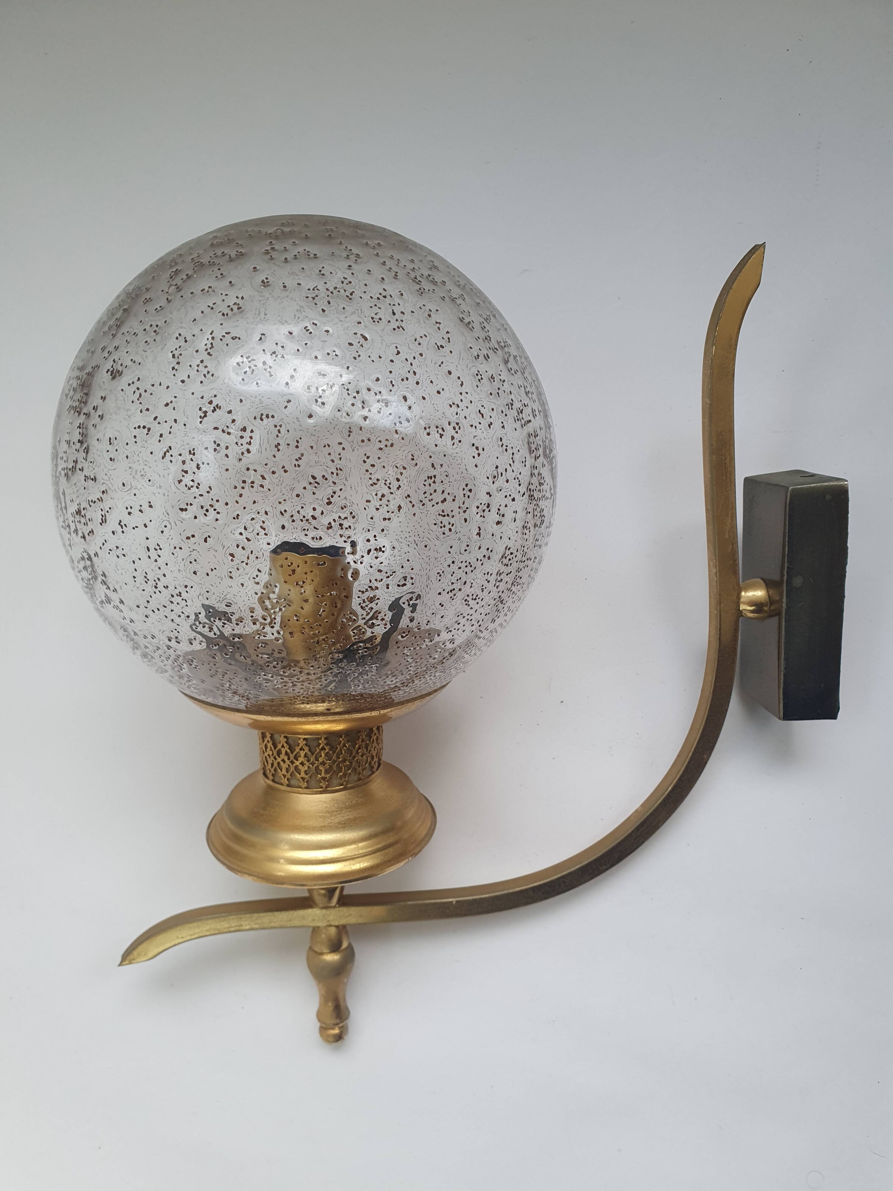 Pair of vintage gold wall sconces with transparent globes